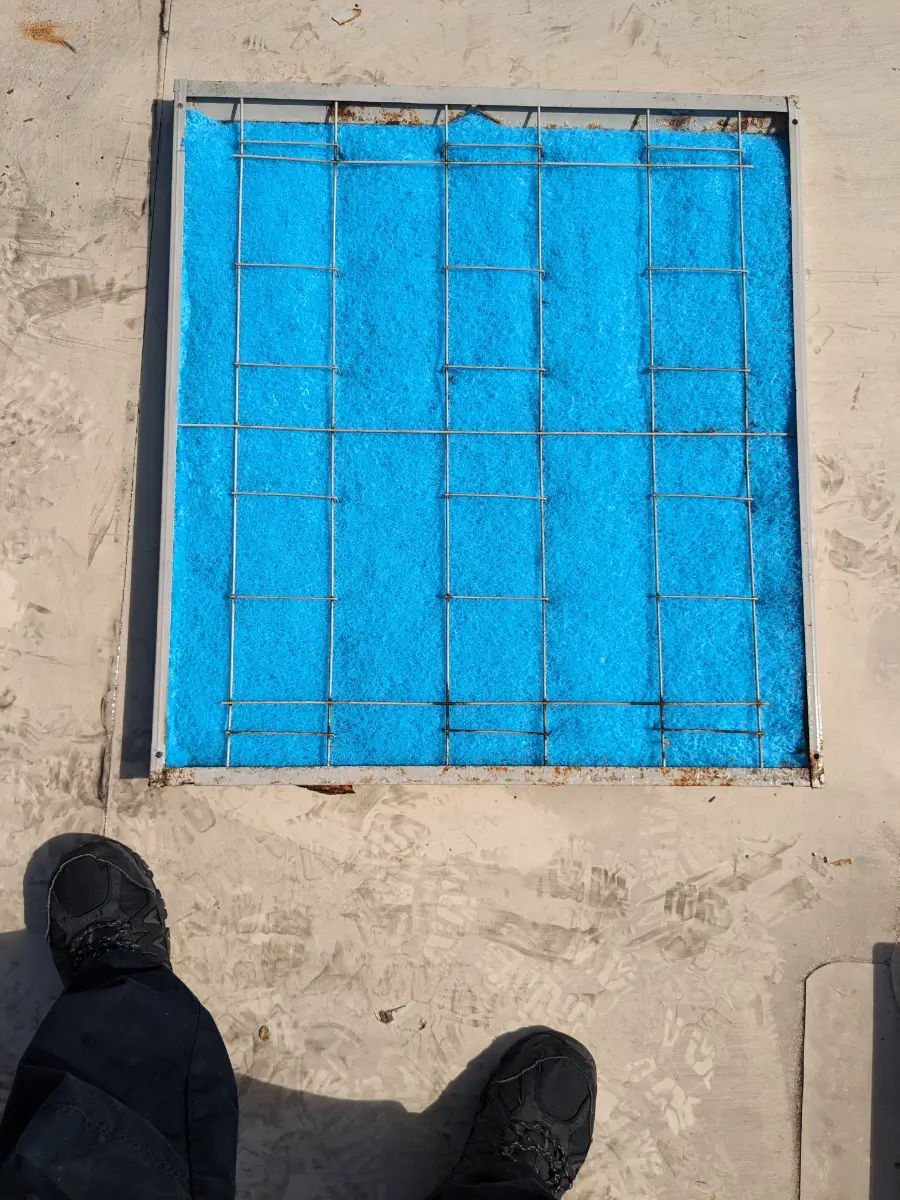 A blue tile window with two people standing on it.